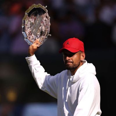 Nick Kyrgios is holding the runners up trophy.